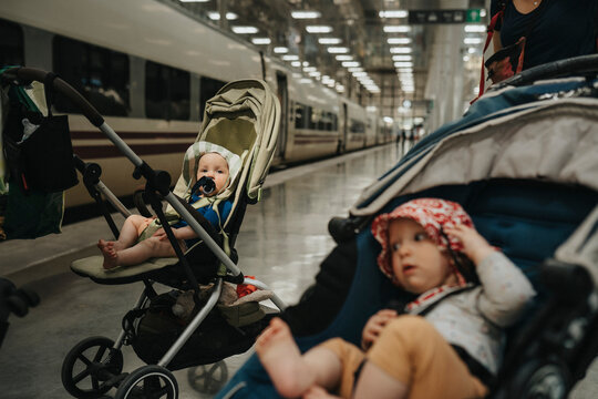 Babies in strollers at train station