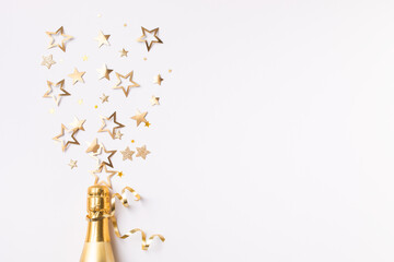 Champagne bottle with confetti stars and party streamers on white festive background. Christmas, birthday or wedding concept. Flat lay. - 681527615