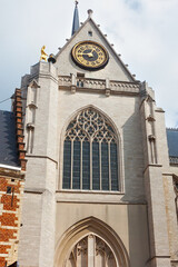 Tower with clock of the famous St. Peter's Church of Leuven. Built mainly in the 15th century in Brabantine Gothic style.