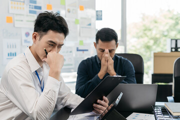 Group of Asian business people, teamwork, people and crisis concept - solving problems in the office.