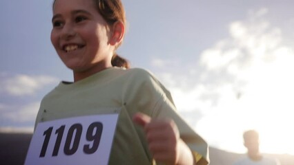 Teenager girl runner during race marathon competition - Children and sport life style