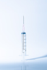 Macro syringe,A 5ml syringe and needle isolated on a white background with detailed clipping path,Close up of a syringe. Focus on numbers