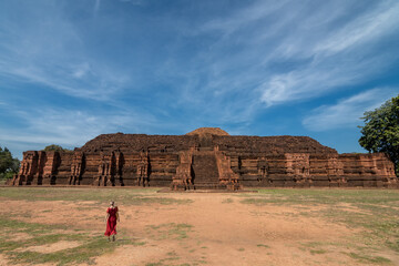 Female tourists walking around Khao Klang Nok is part of the Si Thep historical park which is set...