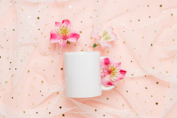Mockup white mug  with pink lily flowers on fabric with glitter, top view. Mockup mug for logo, gift and design.Valentine, mother day, women day, holiday theme