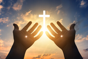 Silhouette scars in hands of Jesus Christ on sunrise background