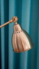 A vintage-looking gold bedside lamp