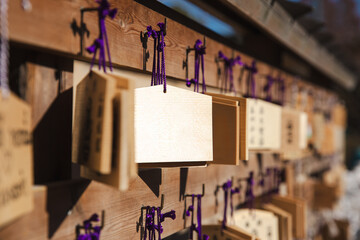 Japan wishing signs small wooden plate calls Ema in Japanese temples or shrines. - obrazy, fototapety, plakaty