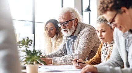 Team of different talents collaborates in a sunny office environment.