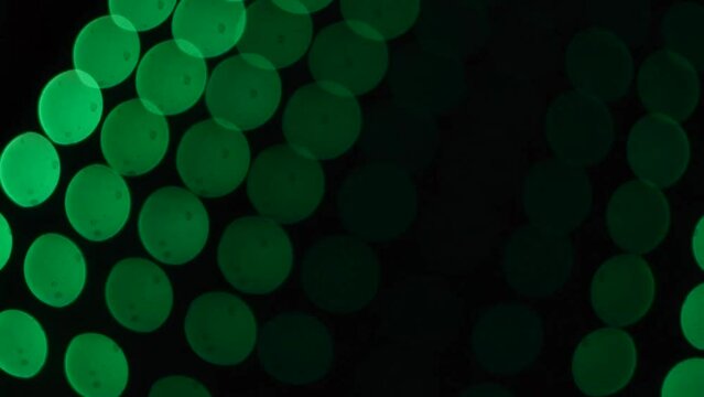Fondo de video de bokeh en color verde con formas circulares tipo fiesta