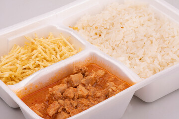 stroganoff lunch box with rice and fries close up
