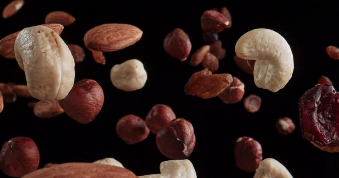 healthy mixture of nuts floating in the air