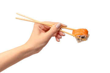 Sushi with salmon in a woman hand isolated.