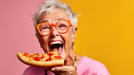 Smiling senior woman savoring pizza in a studio scene.