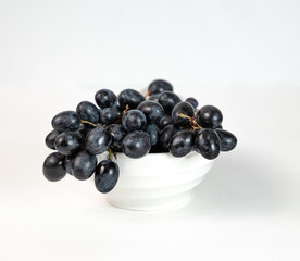 black grapes on a plate