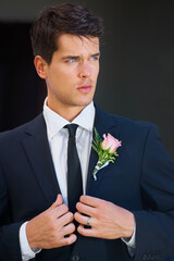 Groom man, thinking and wedding with suit, rose or flower for celebration, event or party for memory. Person, vision and idea for choice, marriage or commitment to relationship with floral decoration