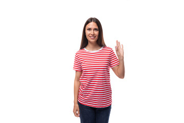 35 year old European lady in a red striped T-shirt shows a gesture that everything is ok