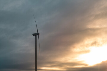 Wind turbine alone beautiful sunset