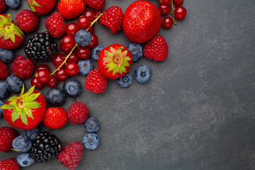 Berries. Various colorful berries Strawberry, Raspberry, Blackberry, Blueberry close-up Bio Fruits,...