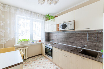 interior apartment kitchen and dining room, refectory area, cooking equipment, table furniture, stove