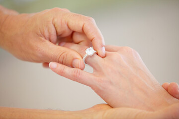 People, hands and wedding ring for marriage, love or commitment together in promise at ceremony....