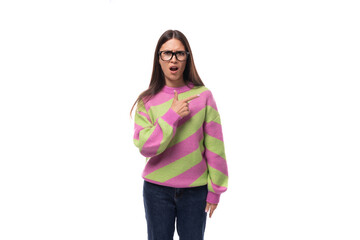 pretty beautiful young european brunette woman with vision glasses dressed in casual striped pink green pullover