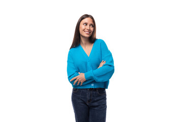 young pleasant slender brunette lady dressed in a blue jacket with a v-shaped on a white background...