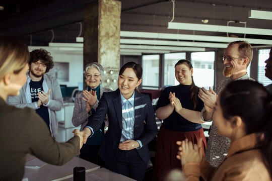 Diverse Team Celebrating Colleagues Achievement