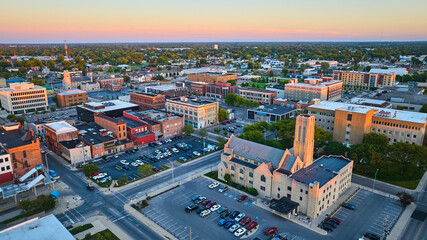 High Street United Methodist Church at sunset aerial Midwest downtown of city, Muncie, IN aerial