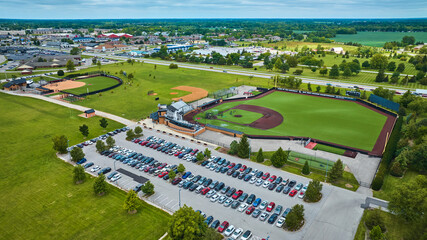 Pristine First Merchants Ballpark Muncie, IN aerial with parking lot and Varsity Softball Complex