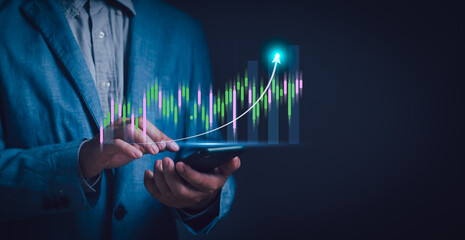 investor or trader Using phone showing virtual stock chart hologram, investment planning and strategy concept, stock market, mutual fund, bonds, digital assets - obrazy, fototapety, plakaty