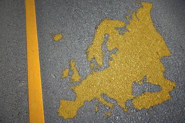 yellow map of europe on asphalt road near yellow line.