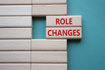 Role changes symbol. Concept words Role changes on wooden blocks. Beautiful grey green background....