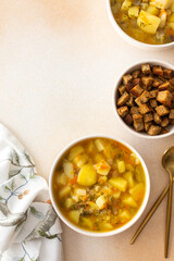 Pea soup with fried croutons, healthy bean soup, top view