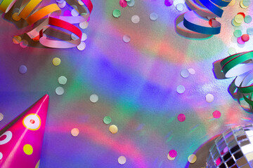 New Year party background with confetti and serpentines, colorful lights