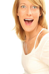 A funny portrait of a blonde Dutch lady with a purposely staged  facial expression opening her mouth 