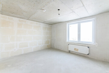 interior apartment rough repair for self-finishing. interior decoration, bare walls of the room, stage of construction