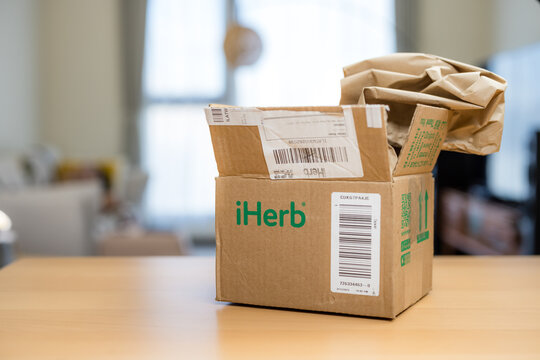 box of iherb parcel at home
