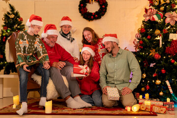 caucasian people big family celebrating christmas party in living room at home, kid girl grandchild...