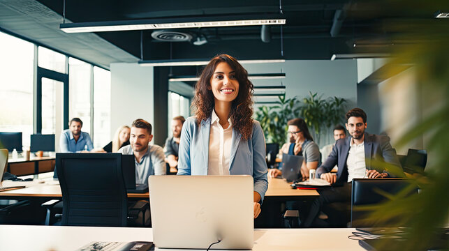 Image of a businesswoman giving a presentation at a conference in a friendly atmosphere in a modern office.