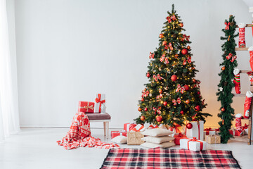 New Year christmas tree with gifts and toys in interior