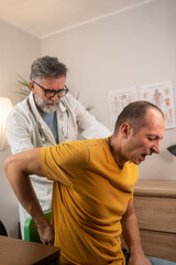 Doctor consulting with patient Back problems Physical therapy concept. 