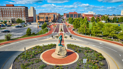 Passing of the Buffalo statue with park aerial of city on gorgeous summer day, Muncie IN