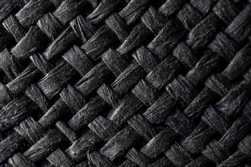Texture of natural raffia fabric dyed black