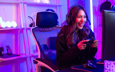 Beautiful happy young female game online streamer or caster smiling with fun, succeed for winner...