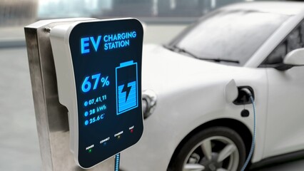 Electric car plugged in with charging station to recharge battery with electricity by EV charger...