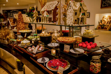 Christmas catering banquet table with different food. Variety of snacks, appetizers, seafood and cooked meals displayed as buffet for festive party
