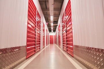 Empty corridor of self-storage facility with closed doors