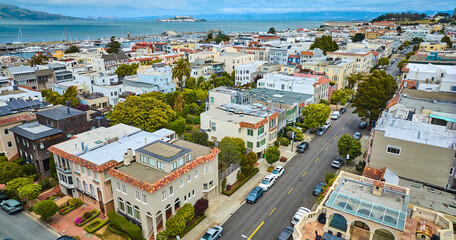 Residential housing and apartments separated by road in aerial San Francisco with Alcatraz Island,...