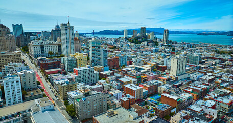 San Francisco aerial residential apartments with view of bay and distant Golden Gate Bridge, CA