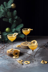 A set of three apple cocktails on a dark background. Apple cider, wine, New Year's treat, festive...